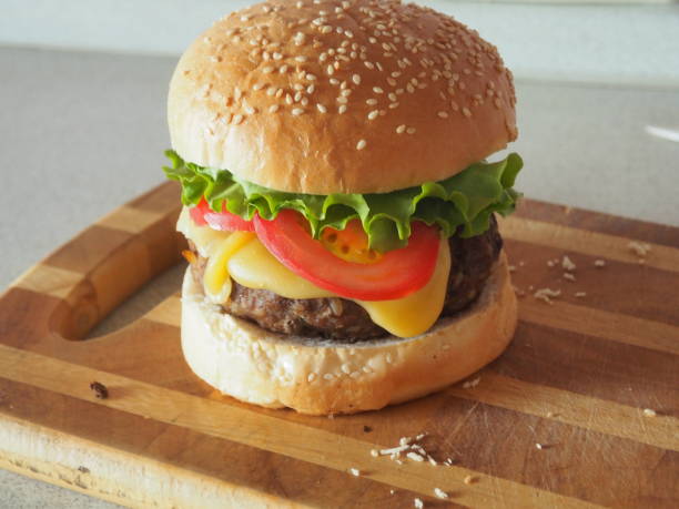 Fresh homemade burger on a wooden board