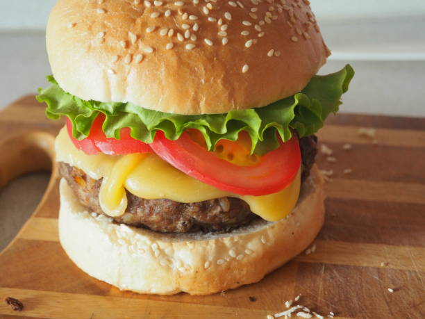 Fresh homemade burger on a wooden board