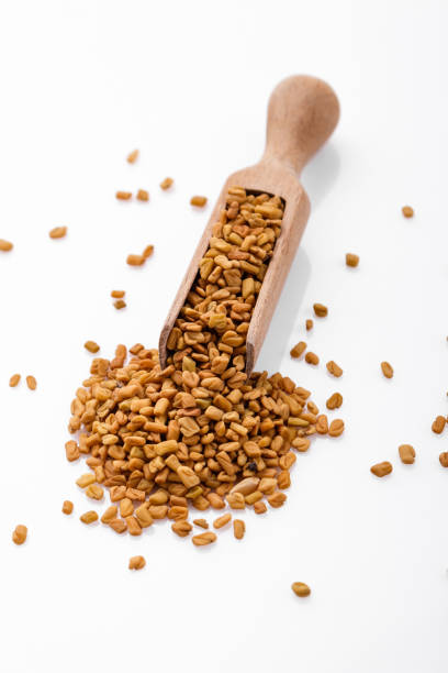 istock fragrant grains of fenugreek on a white background 1069557506