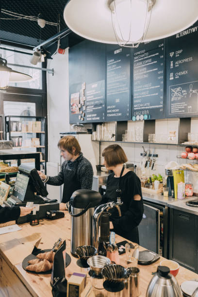 istock Woman and man working at coffee shop 1069562694