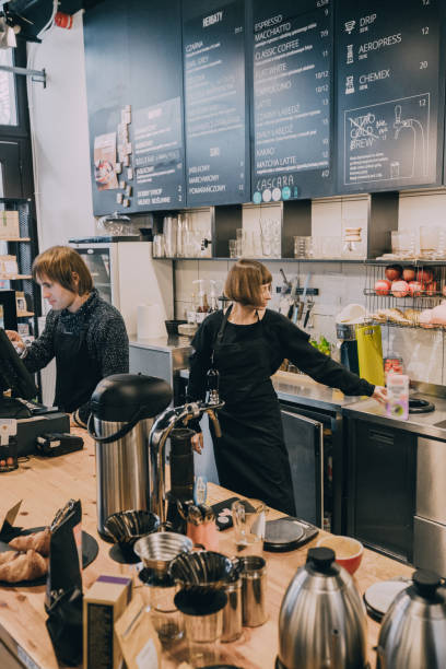istock Woman and man working at coffee shop 1069562696