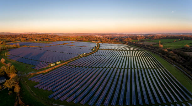 istock Aerial drone view of solar panels at Sunset 1069564422