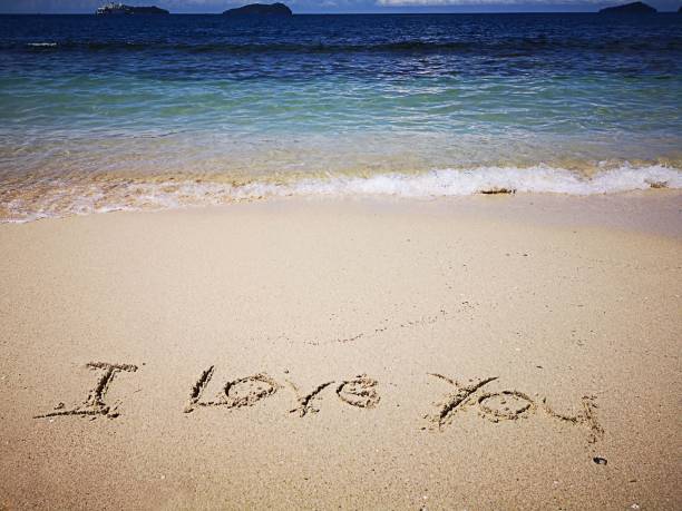 istock I Love You written on the sandy beach 1069565478