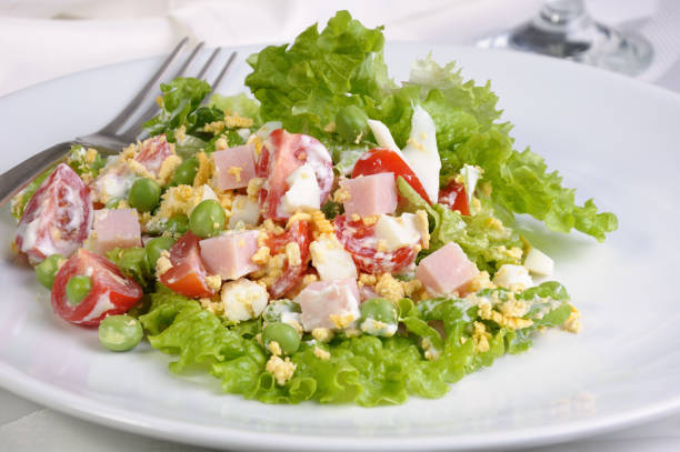 vegetable salad with ham and egg seasoned milk sauce stock photo