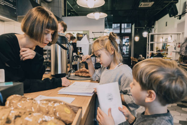 istock Little girl and boy  making order in cafe 1069565642
