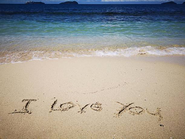 istock I Love You written on the sandy beach 1069566328