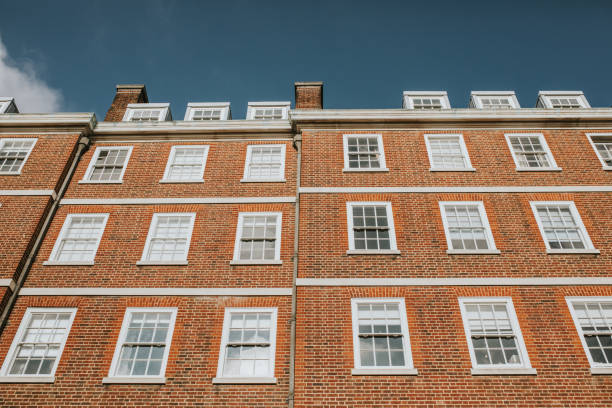 istock Classic english residential building facade with sunlight. 1069569562