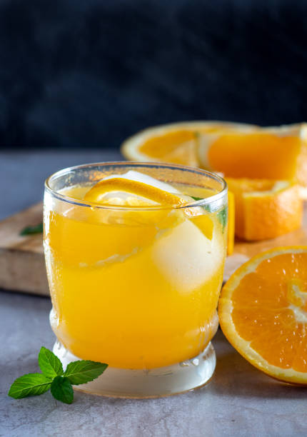 istock Fresh natural orange juice with a mint leaf 1069572782
