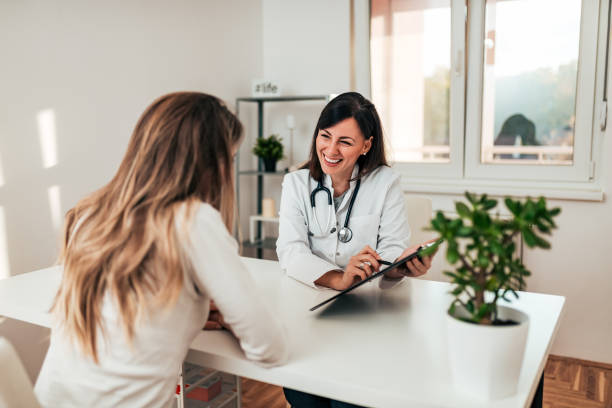 Female specialist explaining diagnosis to her patient.