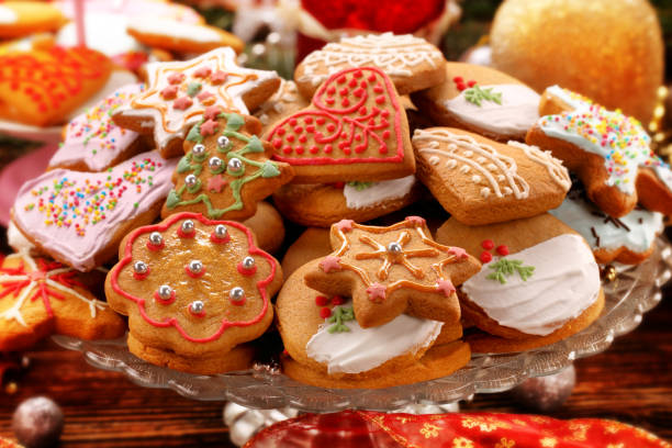 istock Christmas gingerbreads cookies on wooden table 1069579558