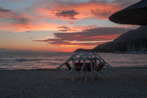 istock Table and chairs atl sunset in Corfu island, Greece 1069579744