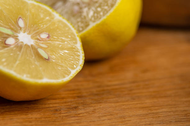 istock Still life with lemon halves on a wooden table 1069581388