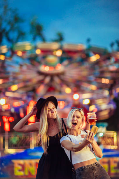 istock Friends in amusement park 1069584750