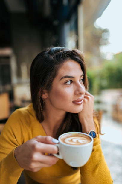 istock Beautiful girl drinking cup of coffee. 1069584840