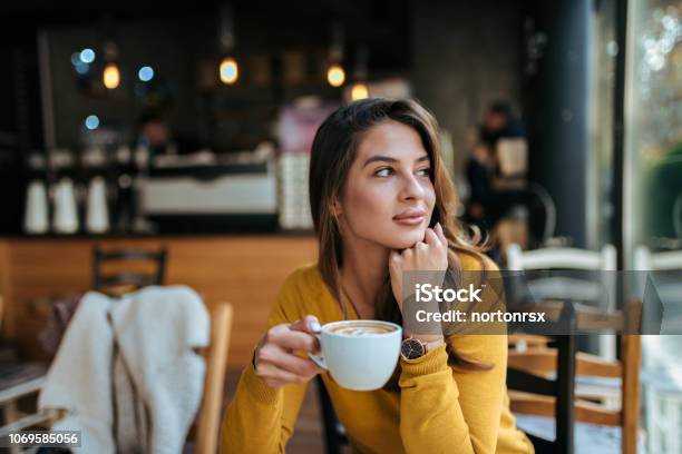 Stylish Young Woman Drinking Coffee At The Cafe Looking Away Stock Photo - Download Image Now