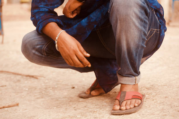Man wearing bracelets sitting in a place unique photo