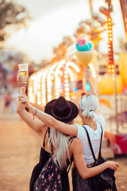 istock Friends in amusement park 1069586314