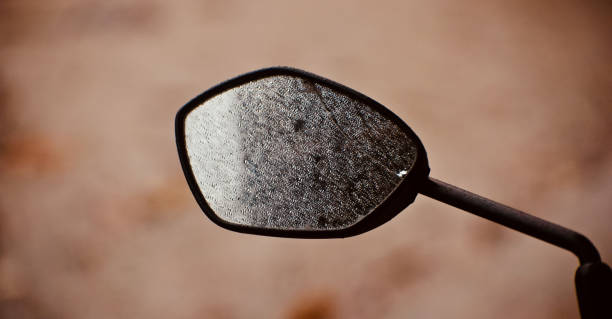 A broken looking glass of a bike A broken looking glass of a bike isolated unique photo broken side view mirror stock pictures, royalty-free photos & images