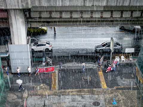 Pathumwan, Bangkok / Thailand - November 17, 2018: High Angle View of People Walking on Street on Rainy Day
