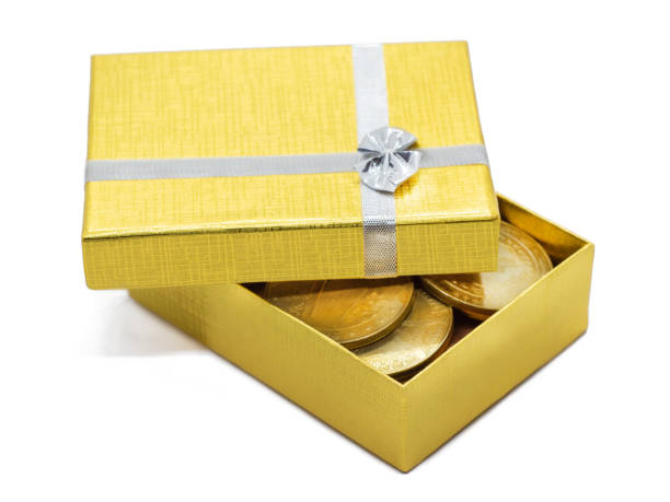 istock gold gift box with gold coins 1069589552