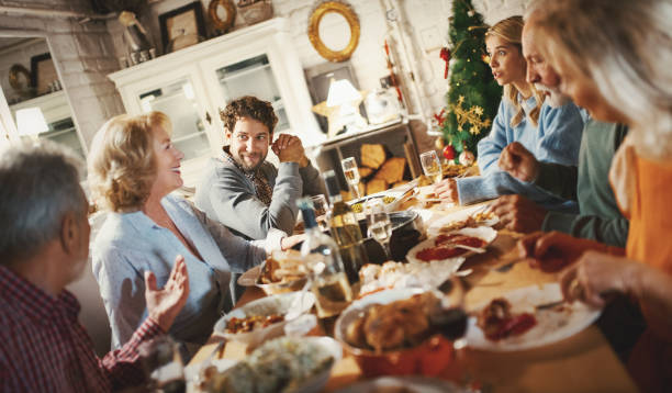 istock Family having Thanksgiving dinner. 1069591546