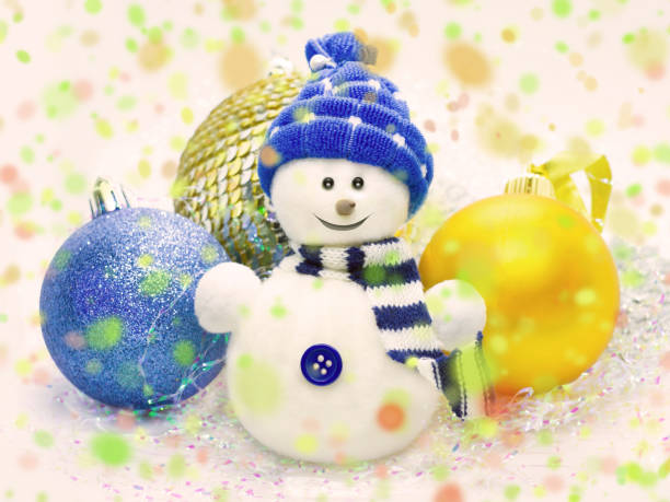 istock Snowman, christmass balls and colorful confetti 1069592014