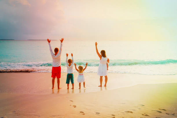 istock happy family with kids having fun at sunset 1069592032