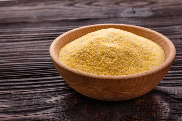 istock raw Italian corn porridge polenta on a rustic wooden background 1069592436