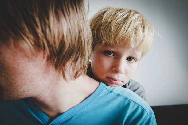 istock Father comforting stressed sad child, parenting, sorrow 1069594776