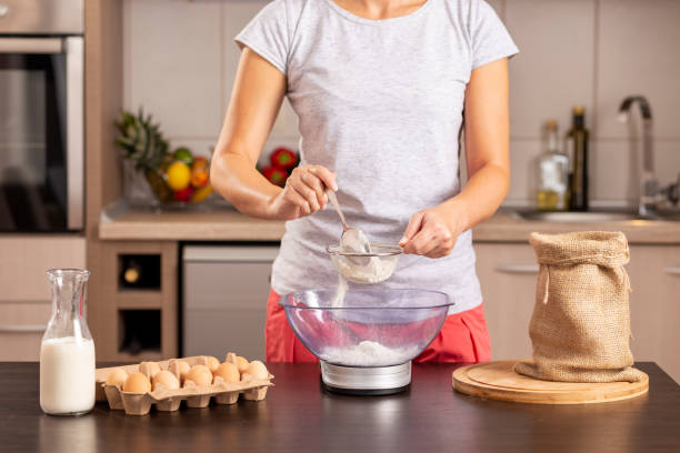 istock Woman measuring flour 1069596862