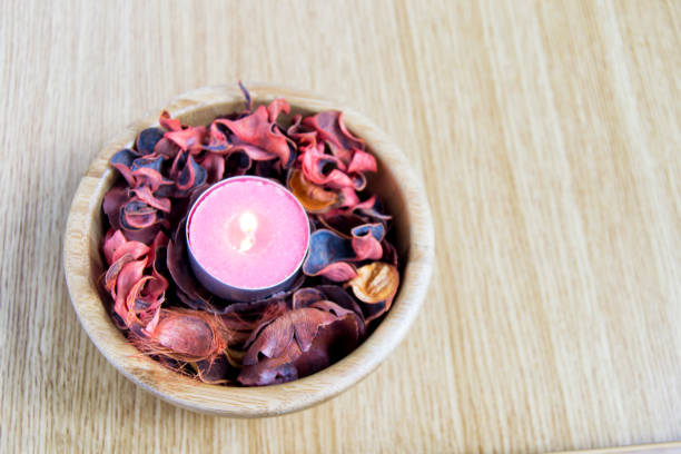 istock pink candle light with potpourri for spa and christmas decoration concept 1069600766