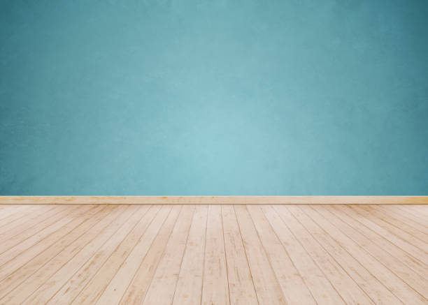 istock Light Blue cement wall with Wooden floor 1069601404