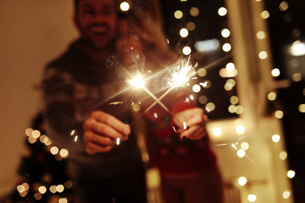 istock Couple playing with sparklers at Christmas 1069608858