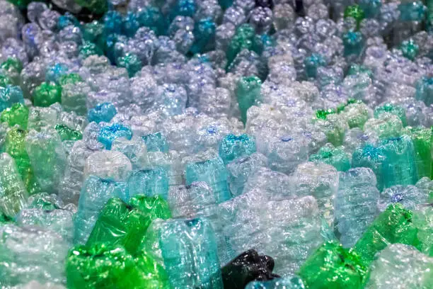 PET plastic bottles stacked in groups in a plastic recycling plant. Plastic recovery process
