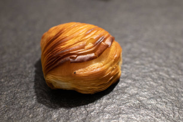 istock Neapolitan curly Sfogliatella on a black granite table 1069609660