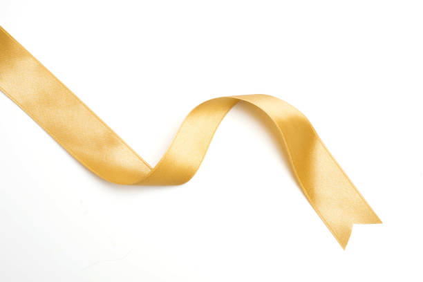 istock Gold ribbon in roll on white background 1069614676