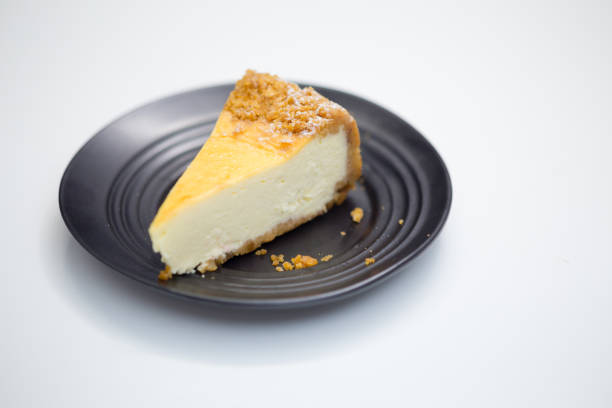 Cheesecake on black saucer