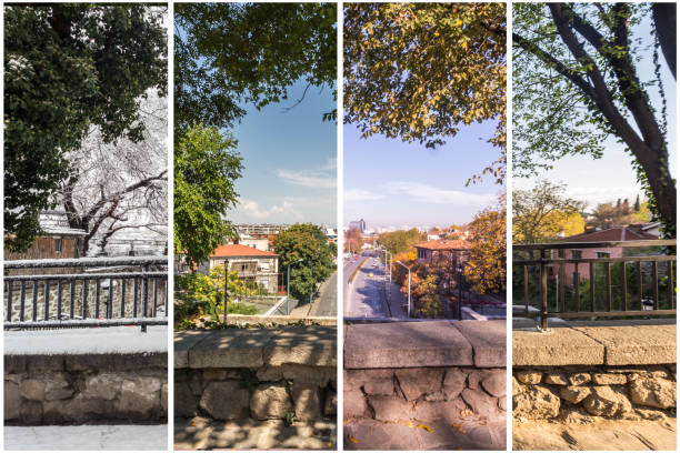 Four seasons concept. The effect of the 4 seasons on the urban environment. Four pictures of one place captured during one year and seamlessly blended in one photography composite. stock photo