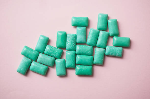 istock peppermint chewing gum group on pink background 1069622142