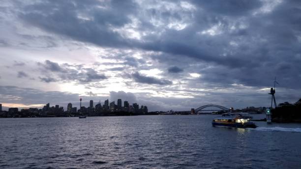 istock sydney and the bridge from a boat at sunset 1069622160