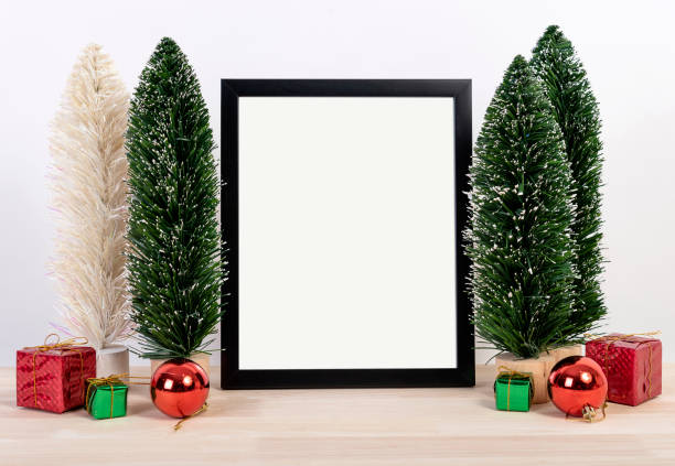 istock Christmas holiday greeting frame design mockup with decoration on wood table. 1069624126