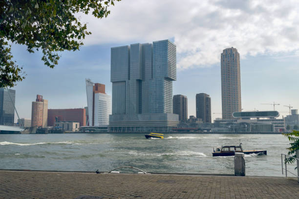 view of modern building of Rotterdam with water taxis in the river view of modern building of Rotterdam with water taxis in the river watertaxi stock pictures, royalty-free photos & images