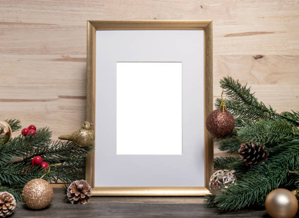 istock Christmas holiday greeting frame design mockup with decoration on wood table. 1069624382