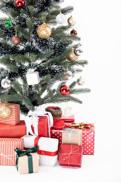 istock Decorated Christmas tree with gift wrapped presents isolated on a white background. 1069624404