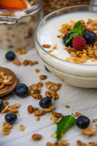 istock Jar full with granola, yogurt and fresh berries, close-up, selective focus 1069635674