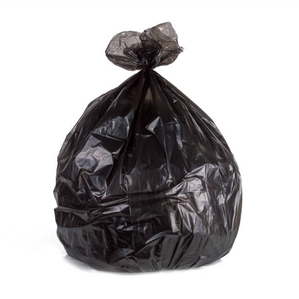istock close up of one black garbage bag isolated white background with 1069635866
