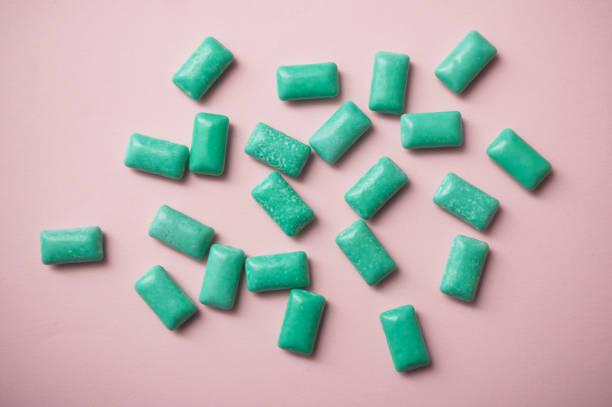 istock peppermint chewing gum group on pink background 1069635926