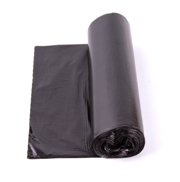 istock Black roll of plastic garbage bags isolated on white background 1069635932