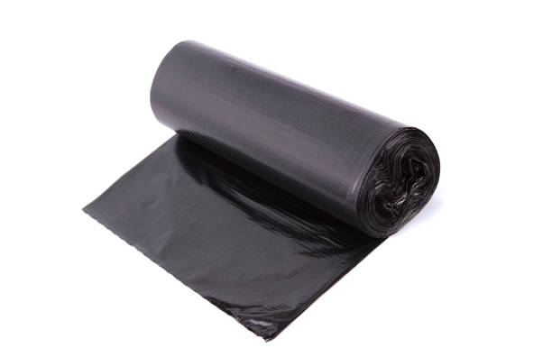 istock Black roll of plastic garbage bags isolated on white background 1069636012