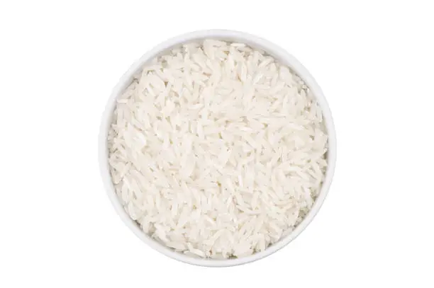 Photo of Top view of one bowl with rice isolated on white background
